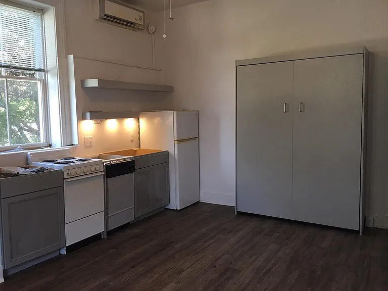 New kitchen cabinets, flooring, floating shelves and Murphy bed. Awaiting new granite countertops.