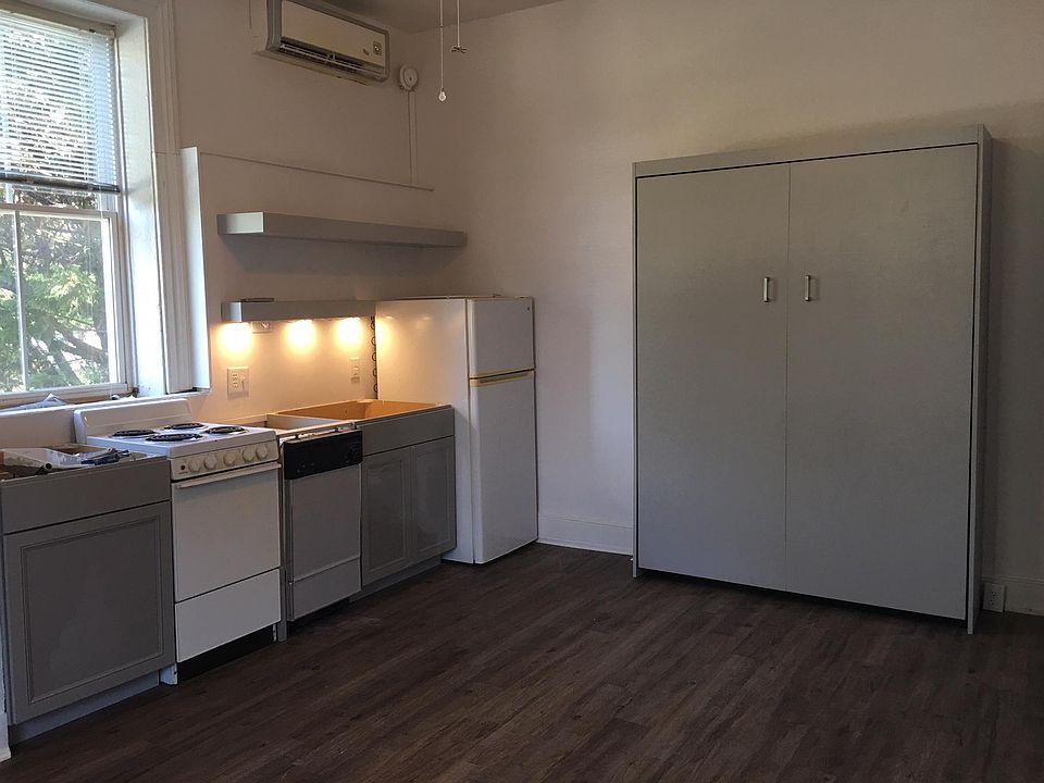 New kitchen cabinets, flooring, floating shelves and Murphy bed. Awaiting new granite countertops.