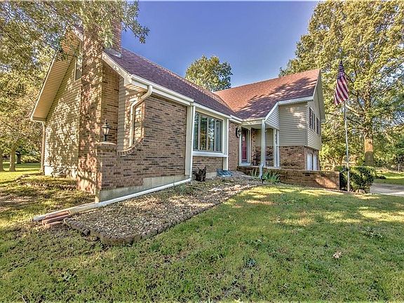 Mature trees and established landscaping add to the charm.