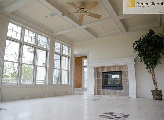 Living room with 2 walls of windows on porch