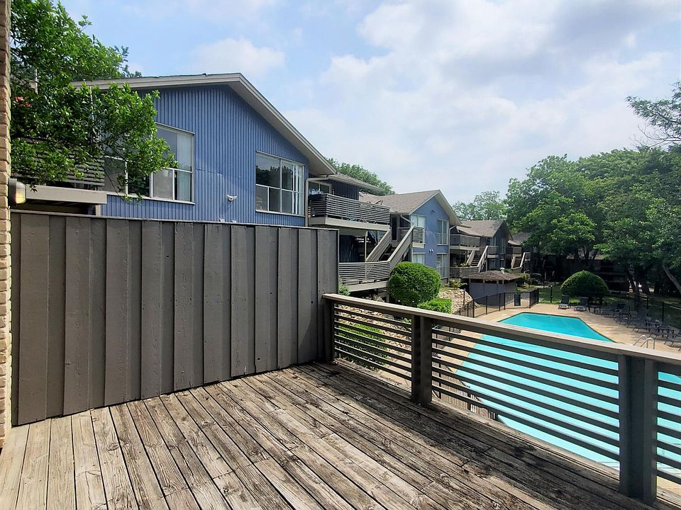 Wooden deck balcony with pool view