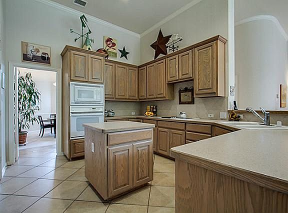 Attractive Island Kitchen with Crown Moulding