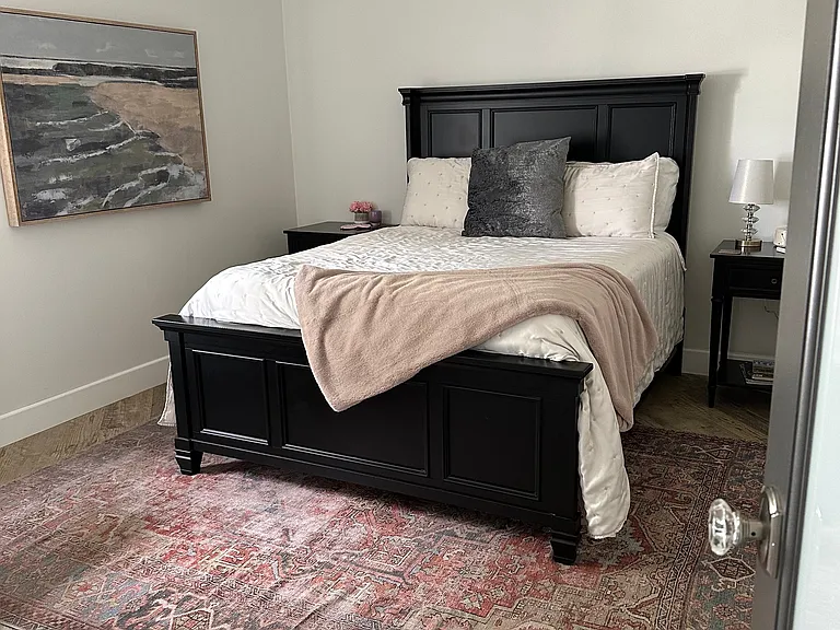 Guest bedroom with large closet, queen bed