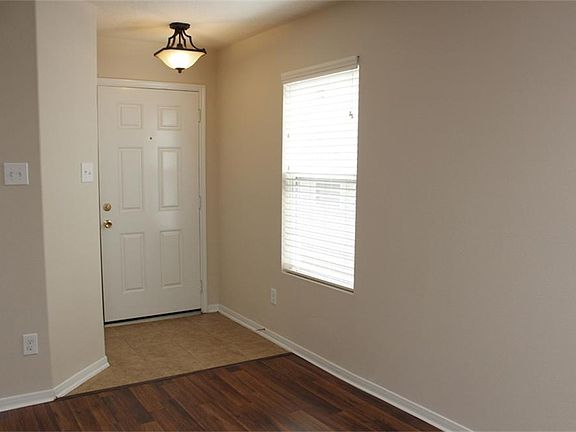 THE CENTER ENTRY HALL PROVIDES ACCESS TO THE ENTIRE HOME WITHOUT UNDUE TRAFFIC THROUGH OTHER ROOMS.