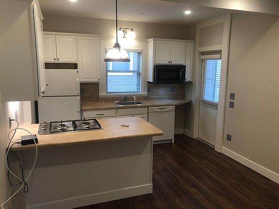 Kitchen view from bedroom doorway.