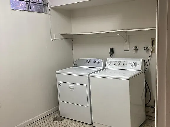 Convenient in-home laundry room with full-size washer and dryer included.