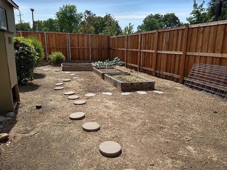 Backyard - Private Yard with planter beds and peach tree