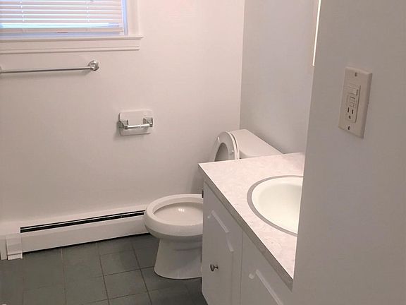 installed a new toilet and vanity with mirror, not yet shown in photo