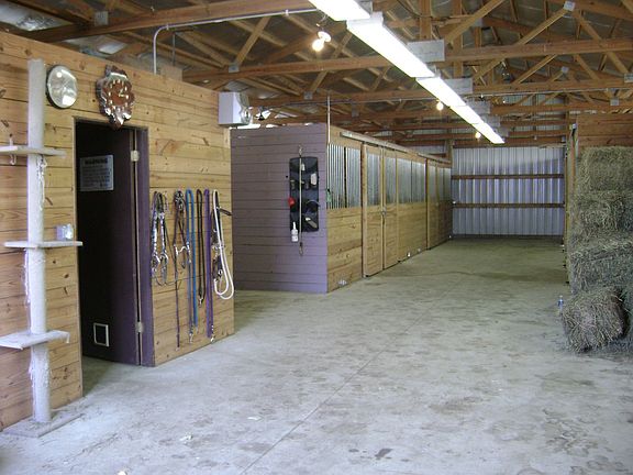 40' x 90" horse barn has 8 stalls, wash bay, tack room and hay storage