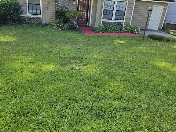 Average front yard and spacious fenced in back yard.