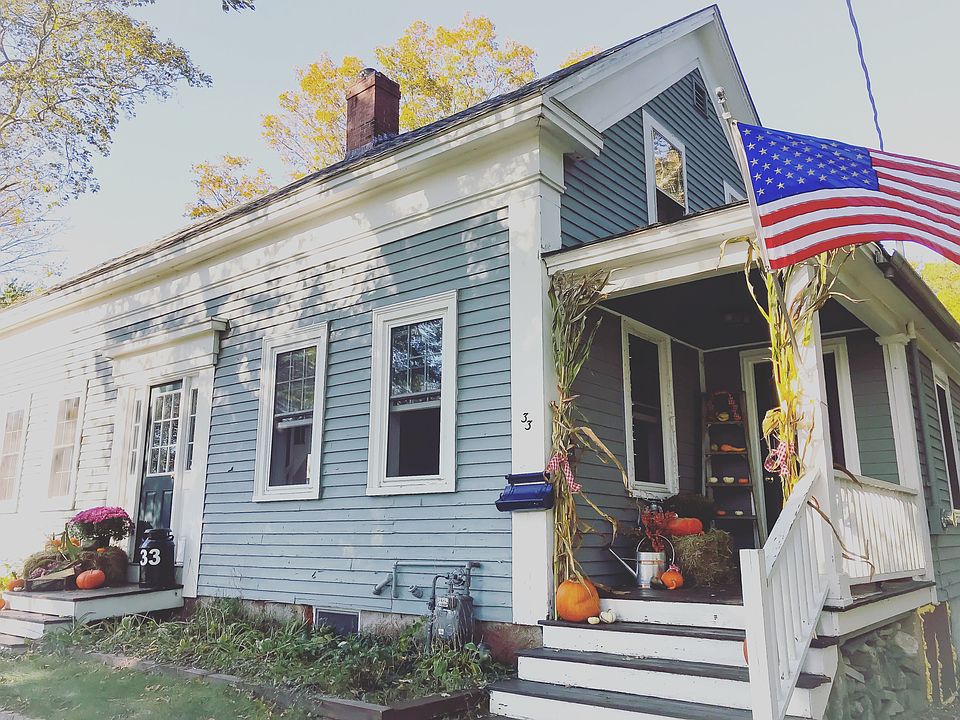 Welcome Home: Historic 200-year-old farmhouse, proudly flying the flag and dressed for fall.