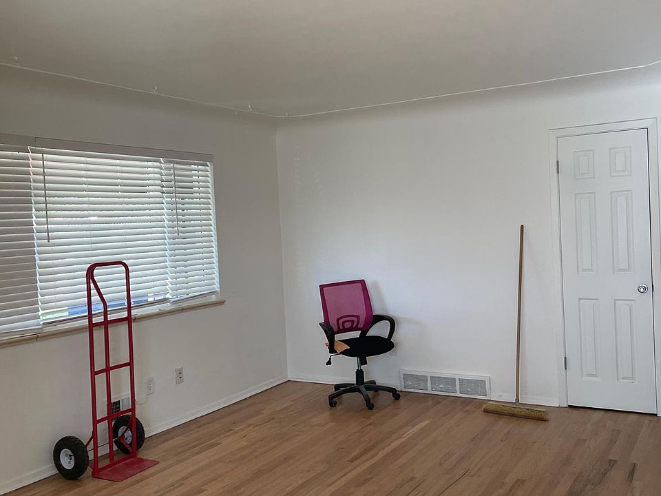 Living Room with coat closet, new paint, floor refinished, new windows, blinds and light fixture