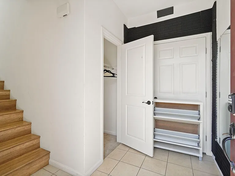 private entrance; coat closet, shoe rack