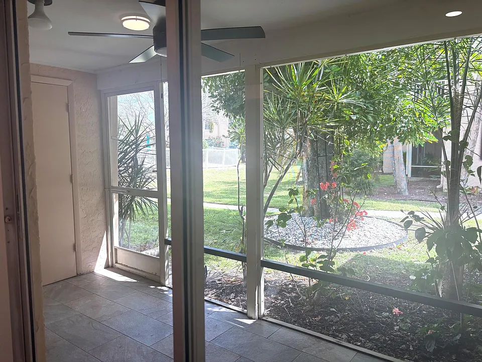 Private screened lanai with direct pool view _ your own peaceful outdoor space in a quiet corner of the community.