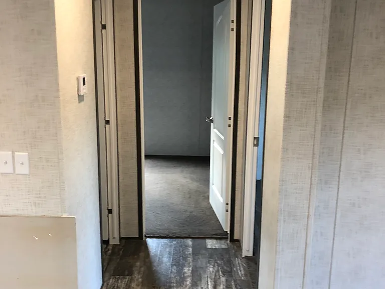 Hall view going to guest bath and guest bedrooms #2 & #3