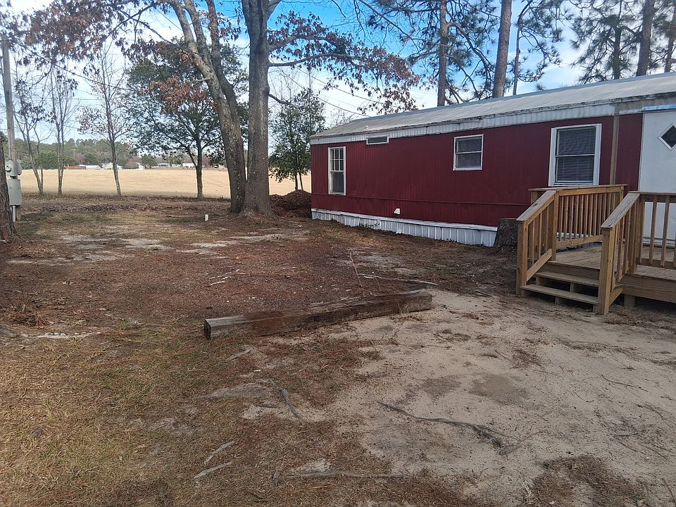 Front of home.. large hay field behind you.