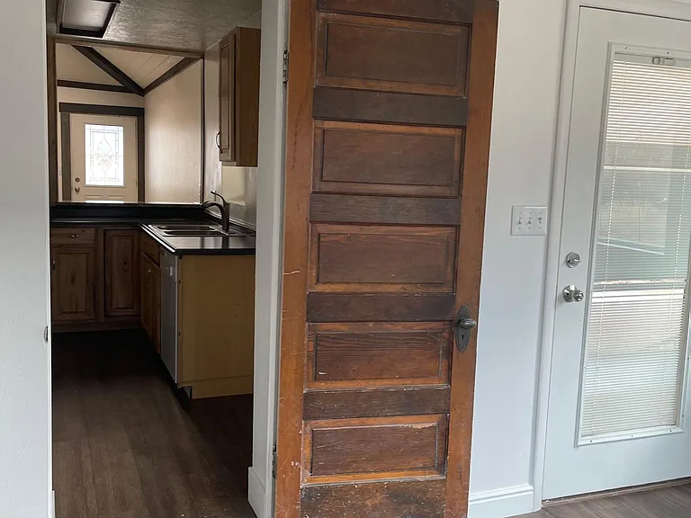 Beautiful 200-year old antique door with entrance to kitchen