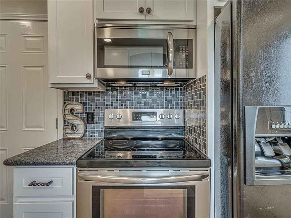 Beautifully renovated kitchen with granite countertops. All new appliances including microwave and refrigerator.