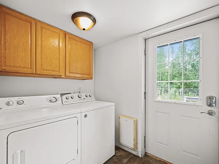 Back door to fenced yard and laundry area