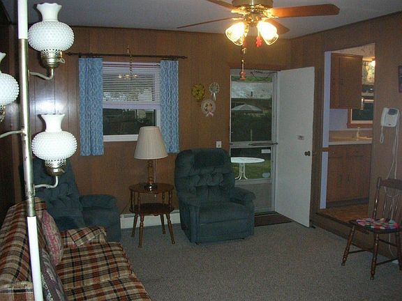 Den leads to backyard and 2 car garage