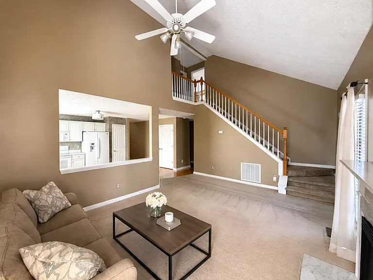 Living room looking towards kitchen and stairs to 2nd level