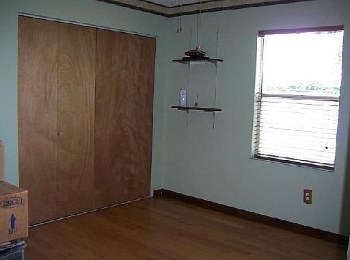 second bedroom with wood floor
