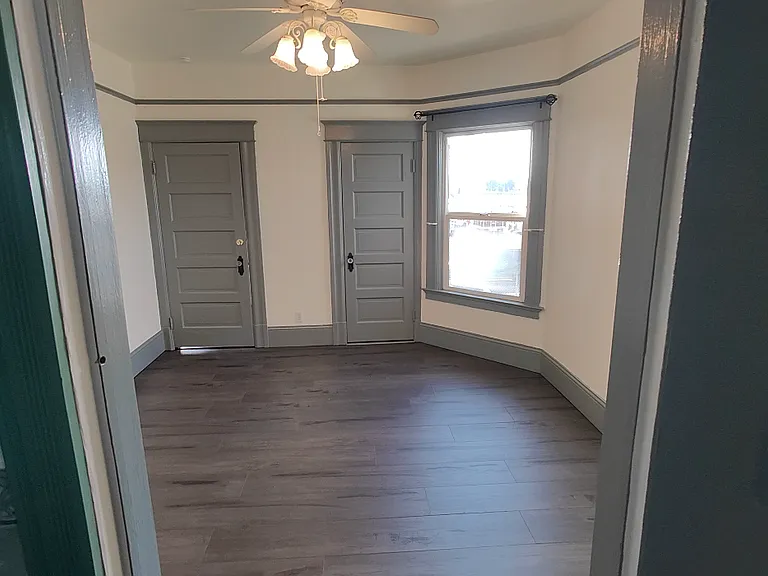 flont bedroom with closet (R) door closed, and door to entry (L) closed