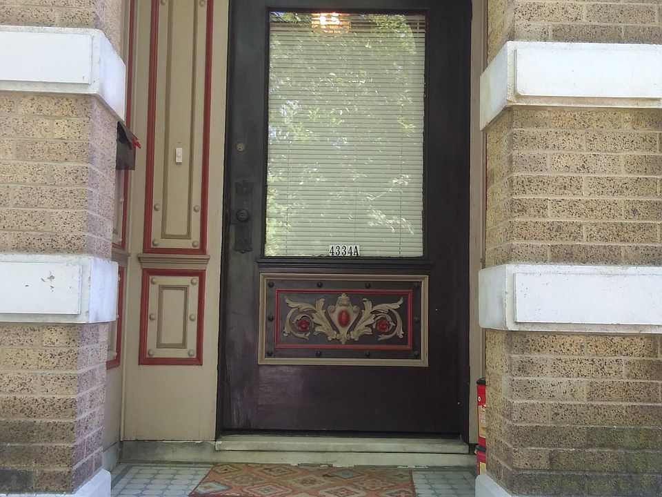 Original detailed woodwork in covered entry