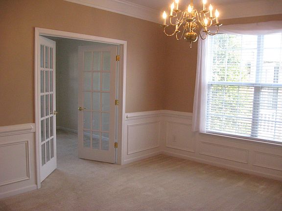 Double french doors from Dining Room to Living Room/Den/Study