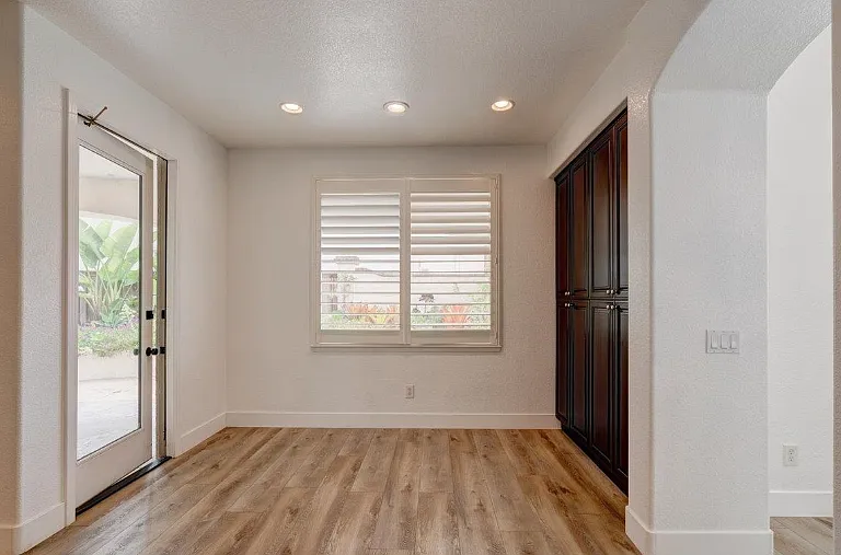 Kitchen nook has a door to the backyard