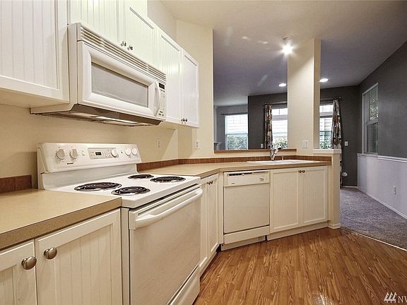 Light and bright kitchen with plenty of storage and countertop space.