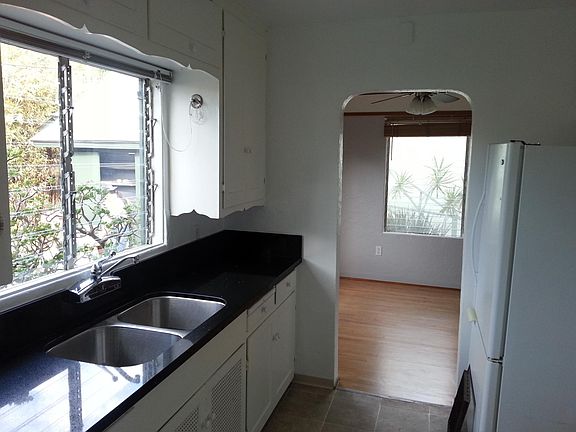 View from kitchen into the dining room / living room (fridge has since been replaced).