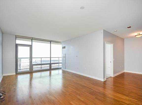 Enjoy magnificent views of the lake, Soldier Field, and other city views.  Living room opens to dini