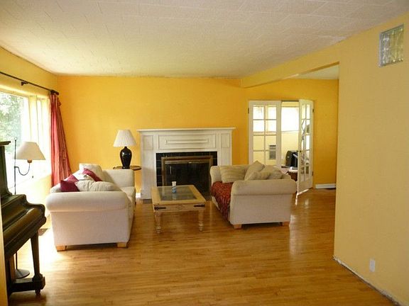 Looking into the living room. Through the french doors is the family room.