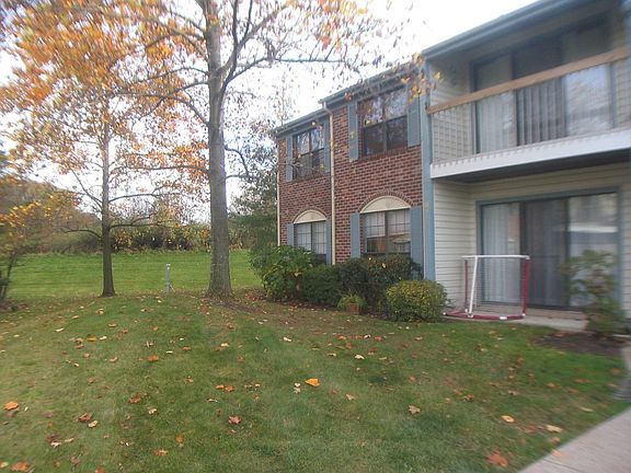 Private Front Entry with Grassy Areas 