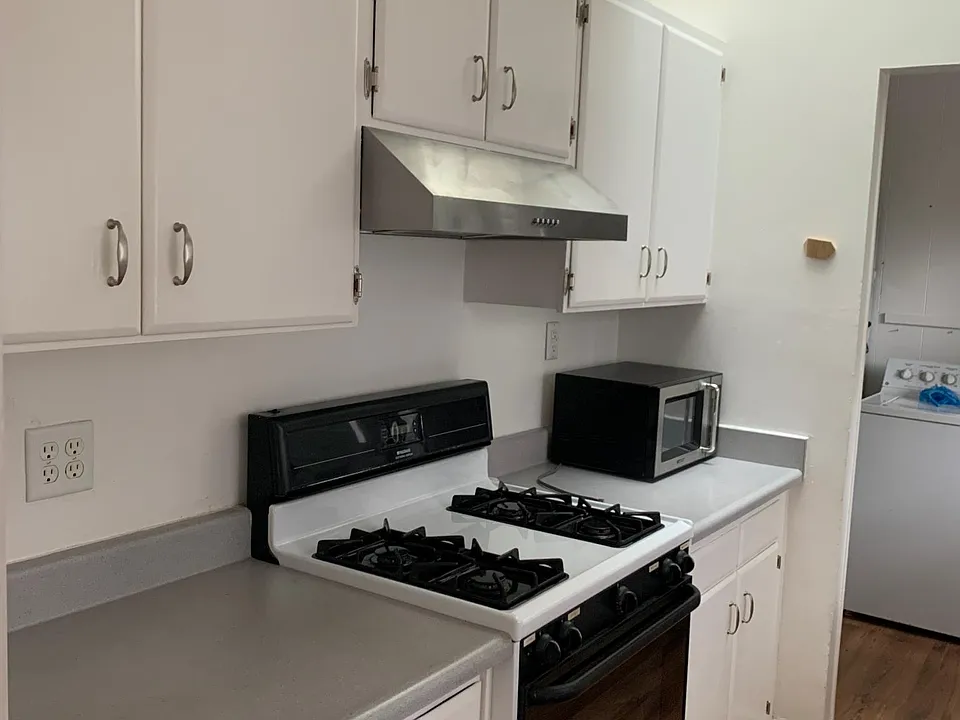 Kitchen galley at end is laundry and utility room