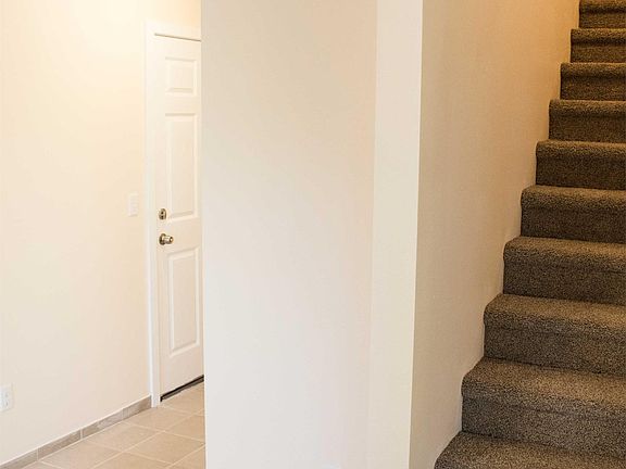 Front main door entrance, tile flooring.