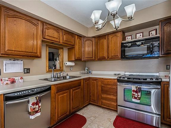 Kitchen with updated stainless steel appliances, stainless steel sink, and fixtures