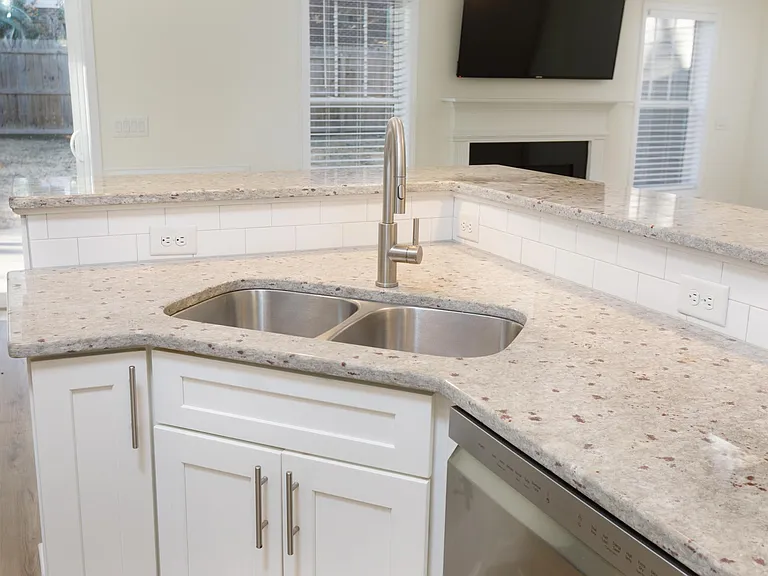 Kitchen opens to breakfast and living room