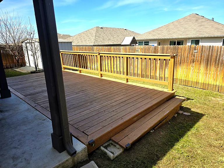 Expansive deck connected to backyard space.