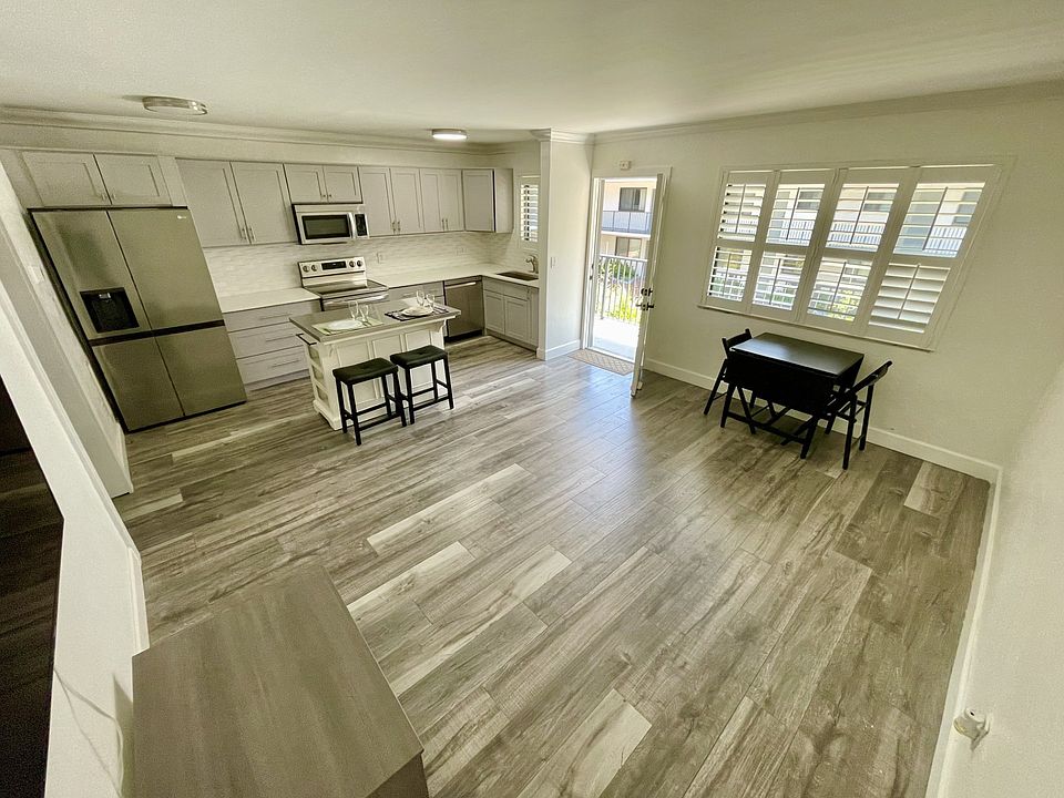 All new kitchen: dishwasher, refrigerator, large sink, microwave and center island seating