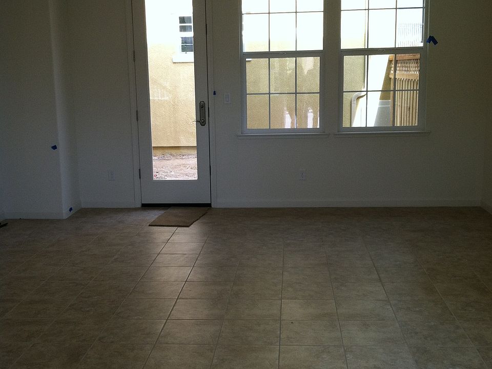 Living room space leading to back side door.