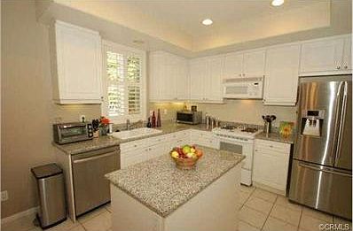 The huge kitchen is wonderful, with granite slab counters, islan