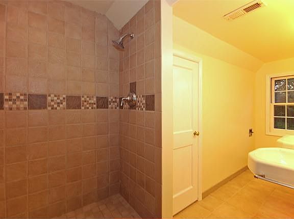 Brand new master bath with custom ceramic-tiled shower & double vanity