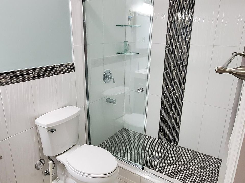 BRAND NEW Bathroom with standing shower. Hot water is included in the rent.