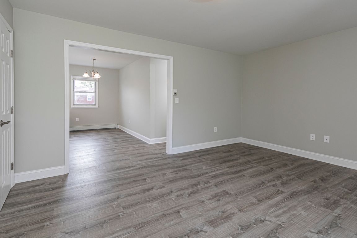 Modern grey composite flooring, luxurious molding and custom paint