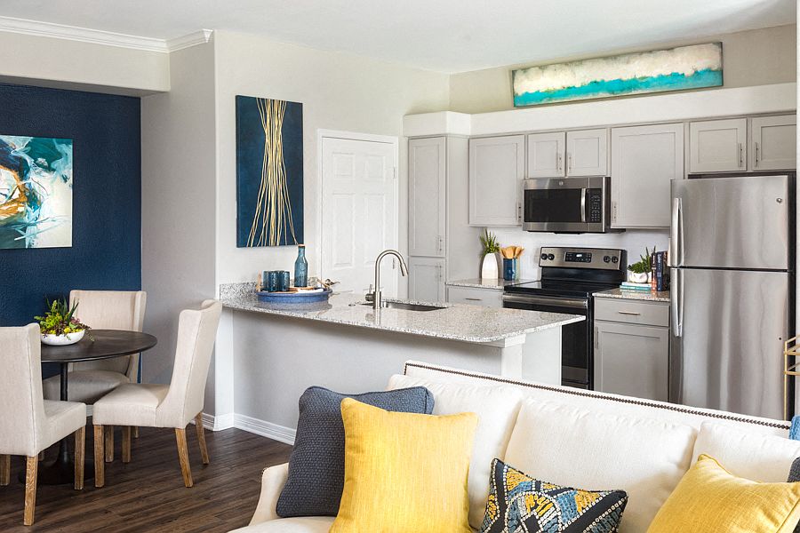 Kitchens feature stainless steel appliances and premium granite countertops