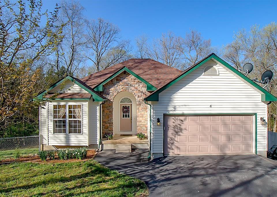 Welcome home to this lovely custom-built home on over an acre!