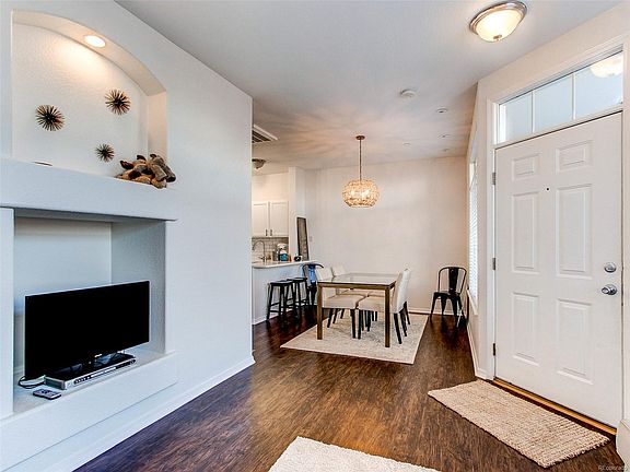 Spacious family/dining area with beautiful wood laminate flooring