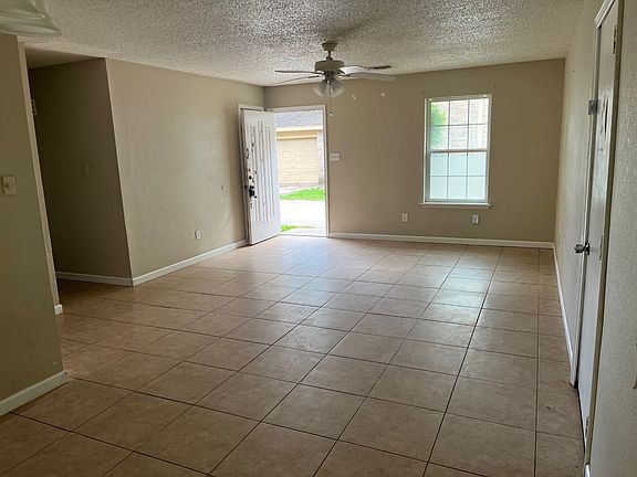 Dining room to living room. Garage door to the right.